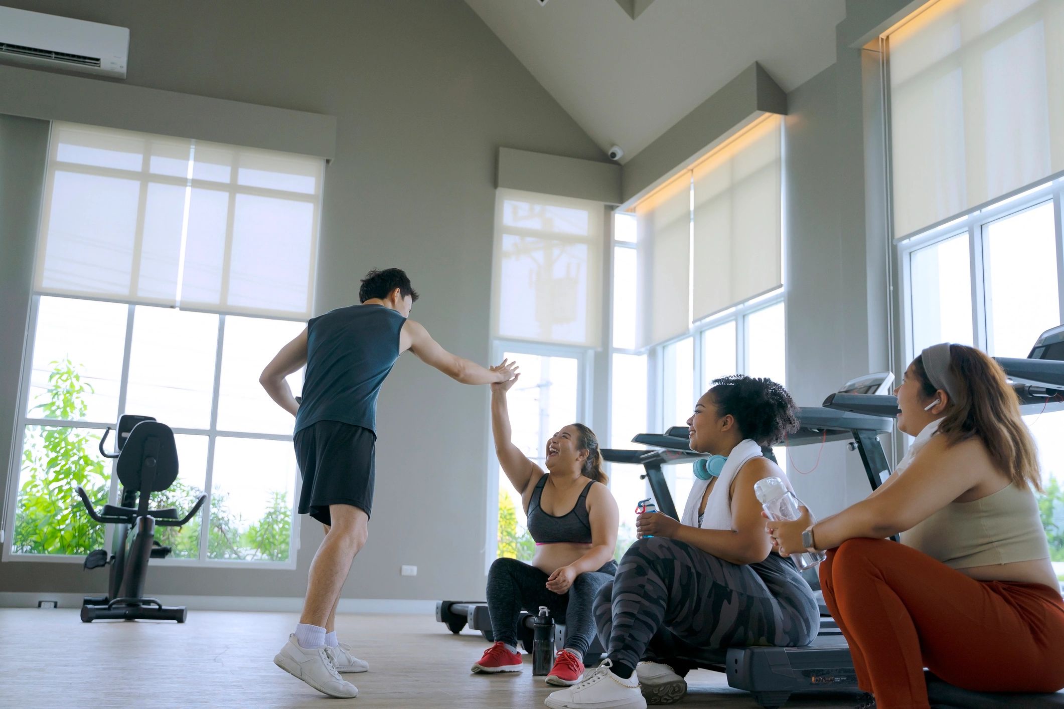 Group fitness class training together in a gym