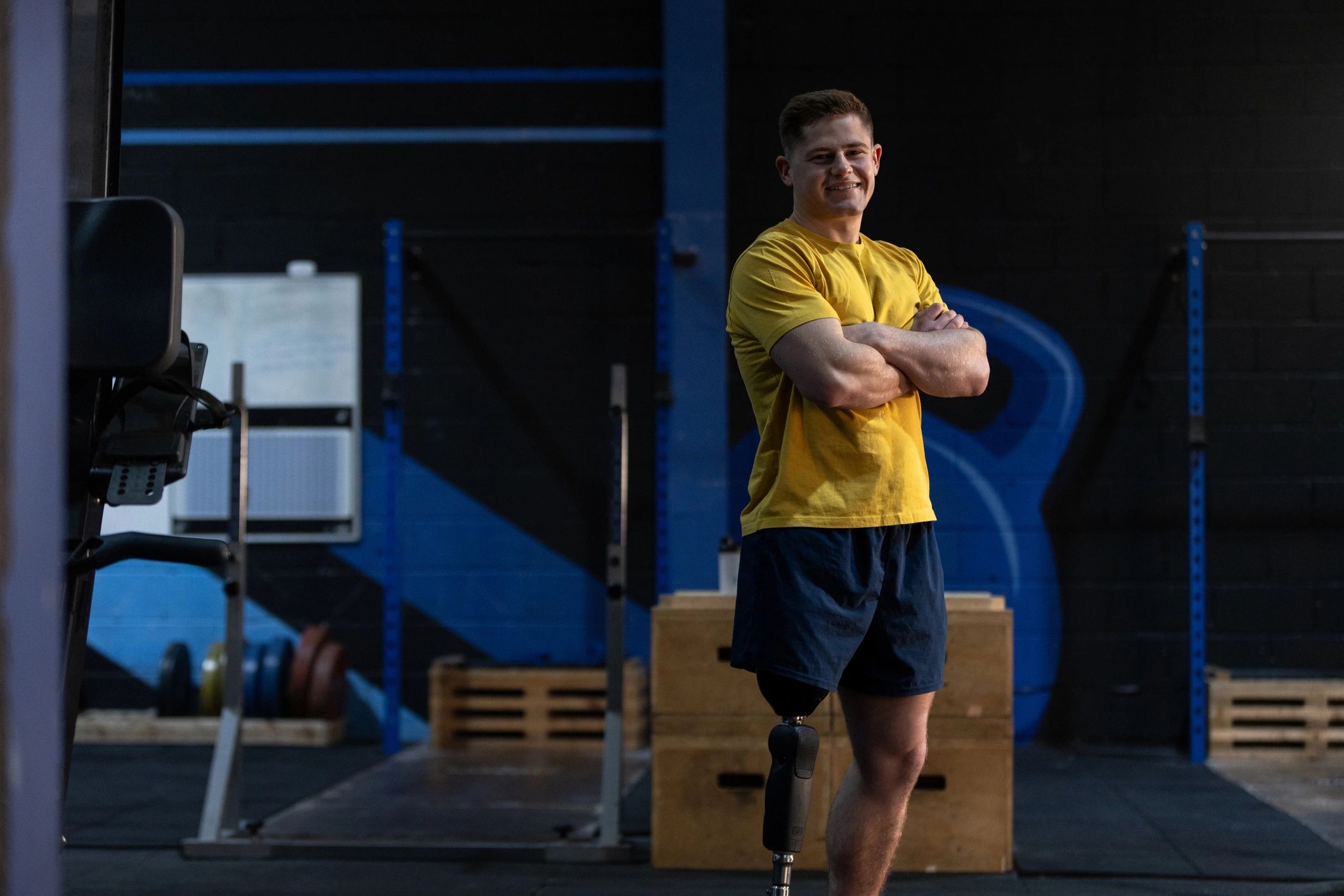 Coach standing confidently in a gym