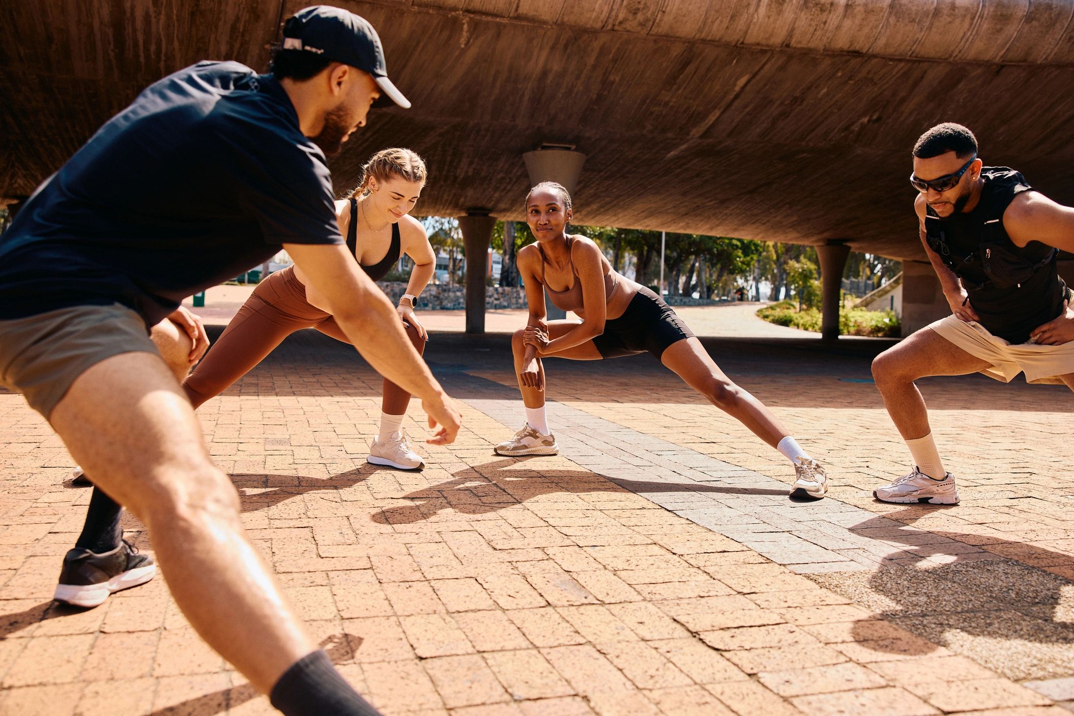 Group fitness session outdoors during a workout warmup