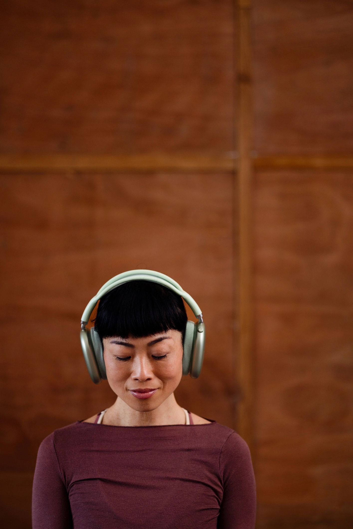 Woman meditating with headphones for stress relief